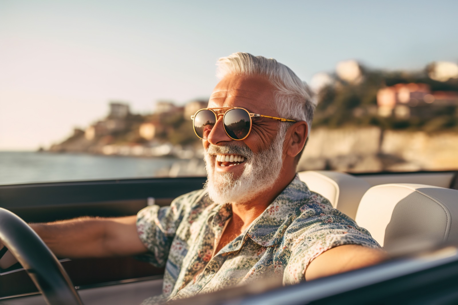 Happy bearded senior man enjoying summer road trip in Italy, luxury cabrio adventure, wealth and freedom lifestyle